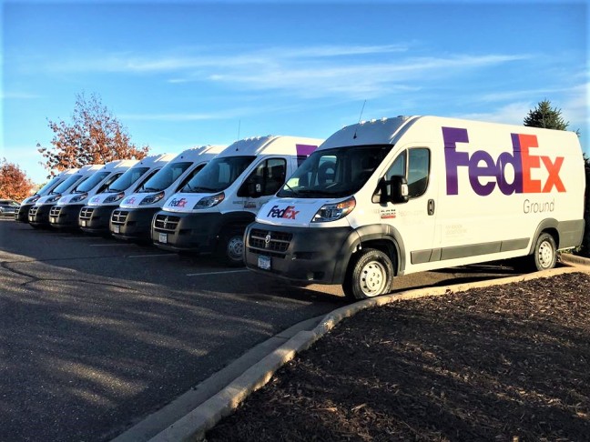 FedEx fleet vehicles with graphics from Impression signs and graphics - St. Paul, MN